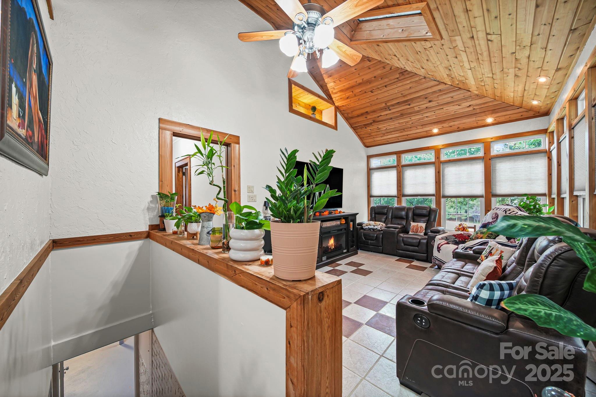 745 Dukeville Road Salisbury, NC 28146 - Photo 29 of 40 a room with furniture and a potted plant