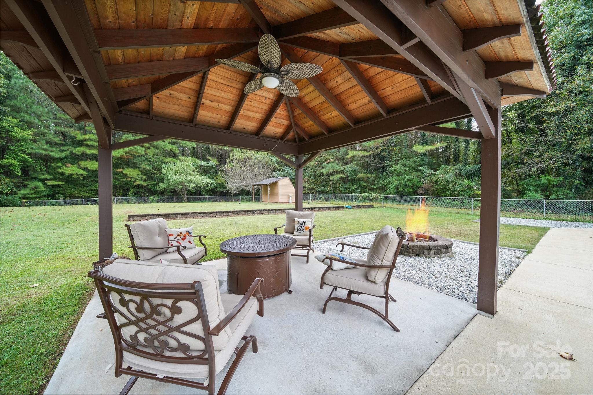 745 Dukeville Road Salisbury, NC 28146 - Photo 36 of 40 a view of a patio with a table chairs and a backyard