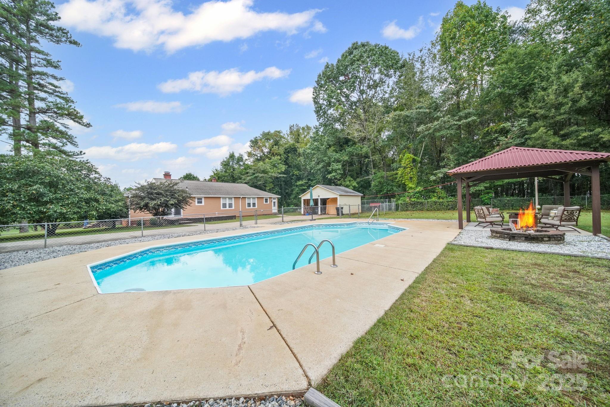 745 Dukeville Road Salisbury, NC 28146 - Photo 37 of 40 a view of a swimming pool with lounge chair