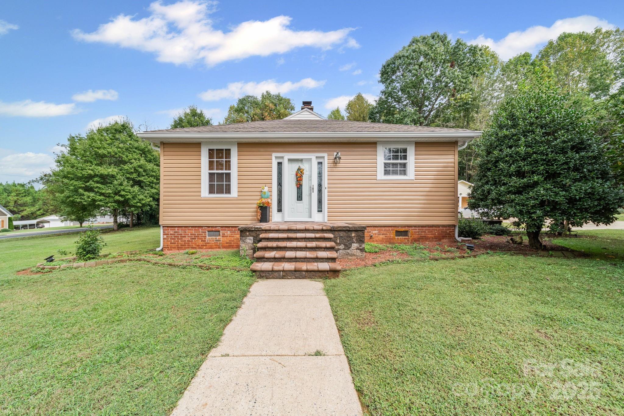 745 Dukeville Road Salisbury, NC 28146 - Photo 7 of 40 a front view of a house with a garden