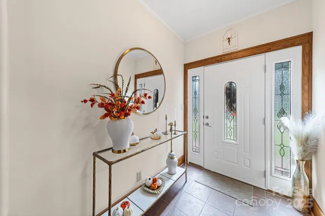 a view of living room with furniture and flowers