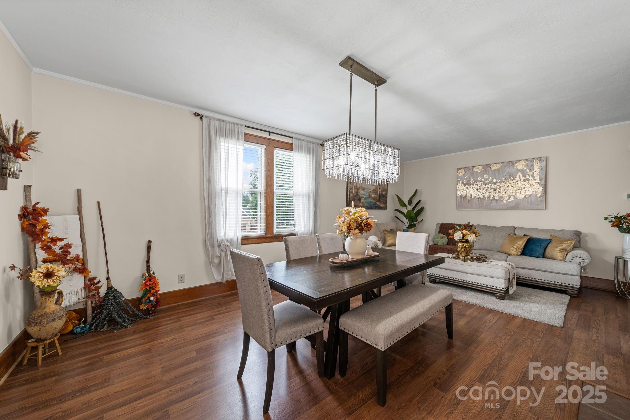 745 Dukeville Road Salisbury, NC 28146 - Photo 10 of 40 a living room with furniture chandelier and a table