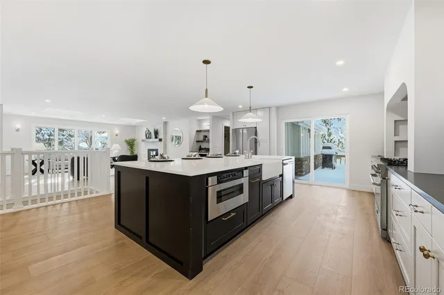 a kitchen with stainless steel appliances a sink and a stove