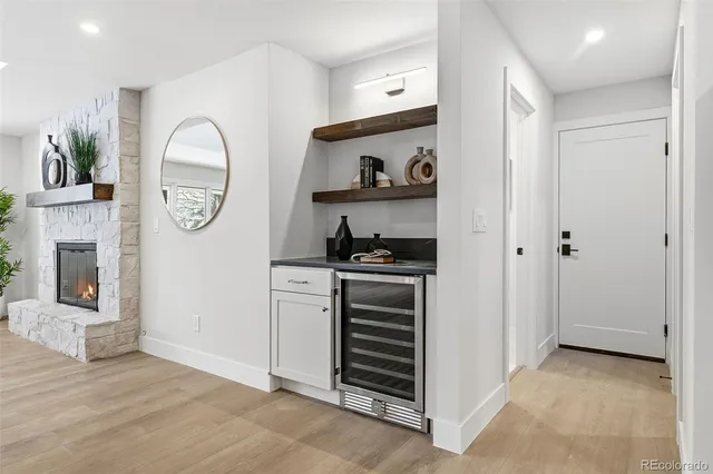 a kitchen with a refrigerator and a stove