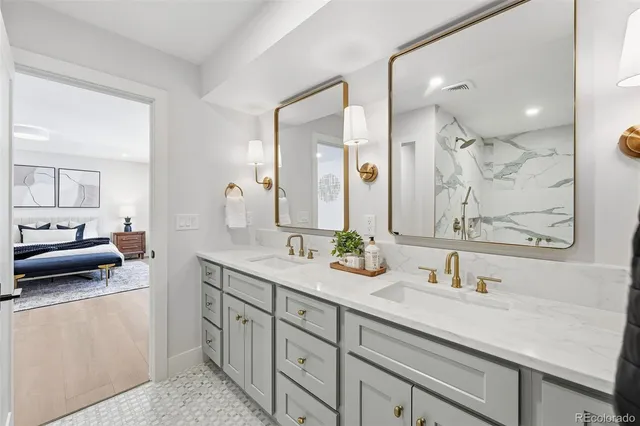 a spacious bathroom with a sink double vanity and a mirror