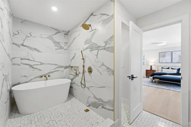 a en suite bathroom with a tub and shower