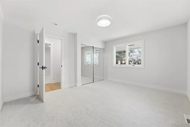 a view of an empty room with a cabinet