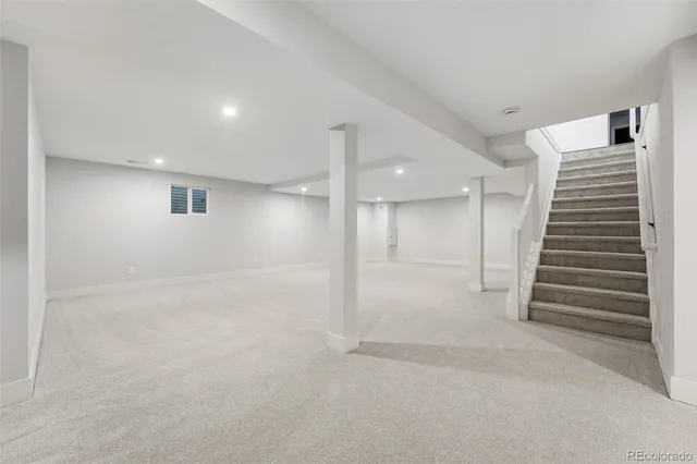 a view of a hallway with stairs