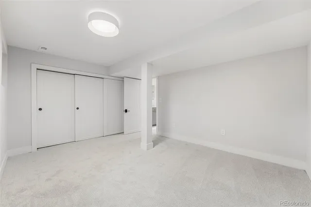 a bathroom with a toilet a sink a mirror and bathtub