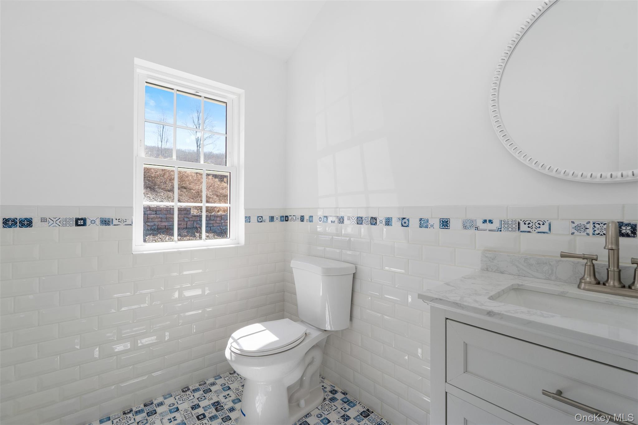 70 Barmore Road LaGrangeville, NY 12540 - Photo 24 of 47 Half bathroom featuring tile walls, wainscoting, tile patterned floors, and vanity