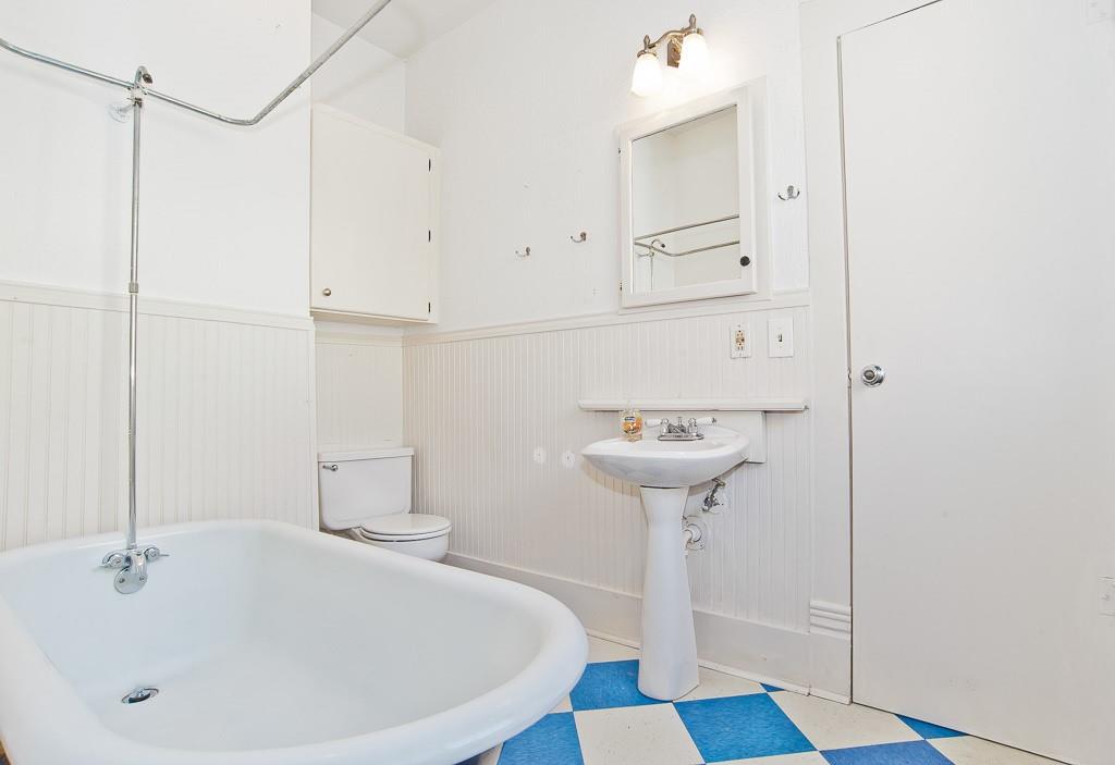 4910 Victor Street, Unit 4 Dallas, TX 75214 - Photo 14 of 24 a bathroom with a sink and a mirror