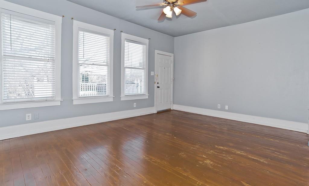 4910 Victor Street, Unit 4 Dallas, TX 75214 - Photo 17 of 24 an empty room with wooden floor and windows