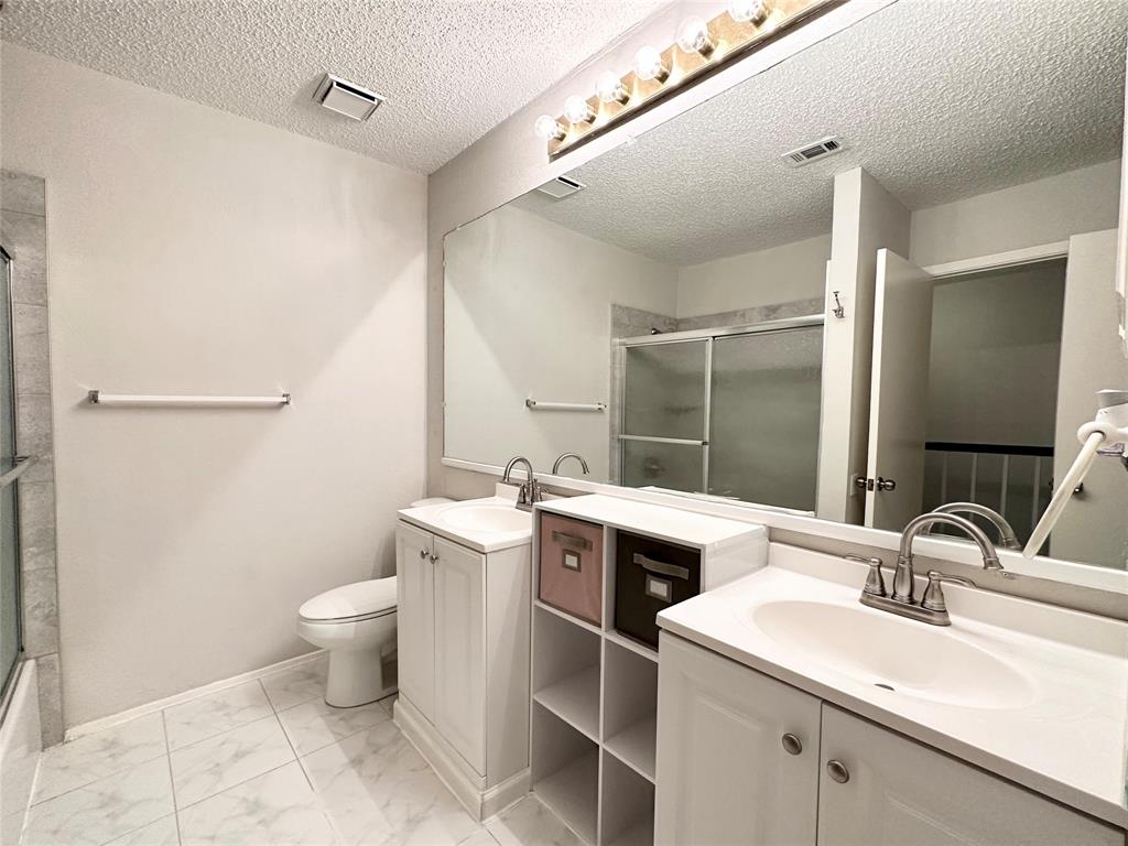 3801 14th Street, Unit 2305 Plano, TX 75074 - Photo 14 of 16 a bathroom with a sink toilet and mirror