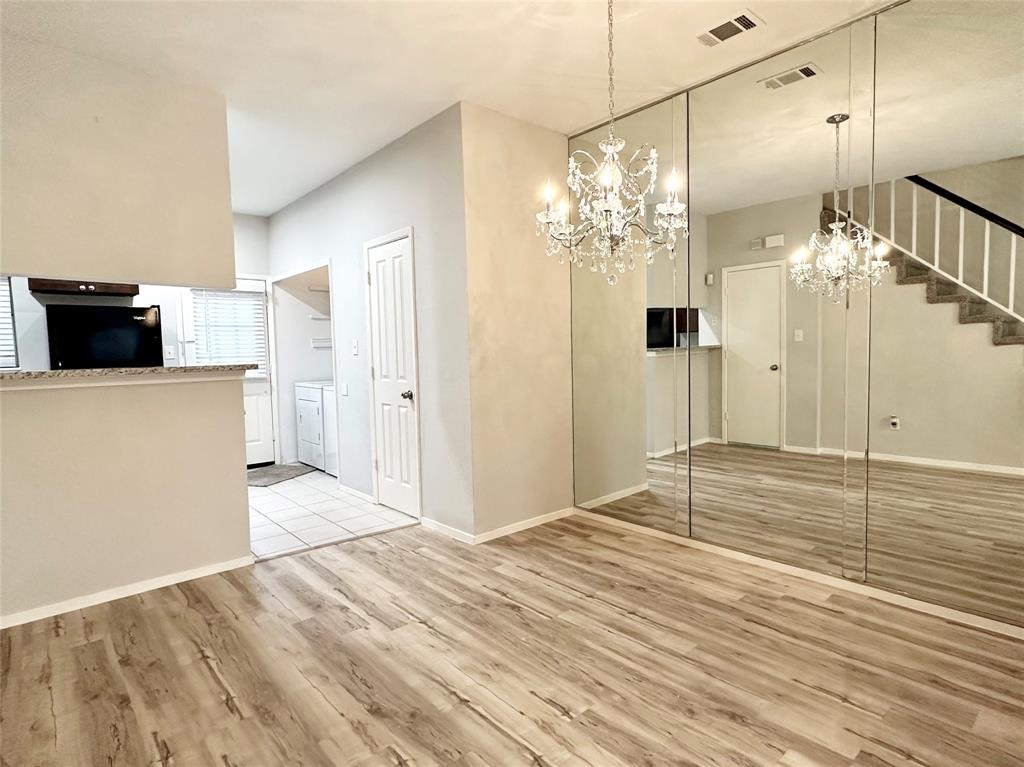 3801 14th Street, Unit 2305 Plano, TX 75074 - Photo 5 of 16 a view of a livingroom with a chandelier