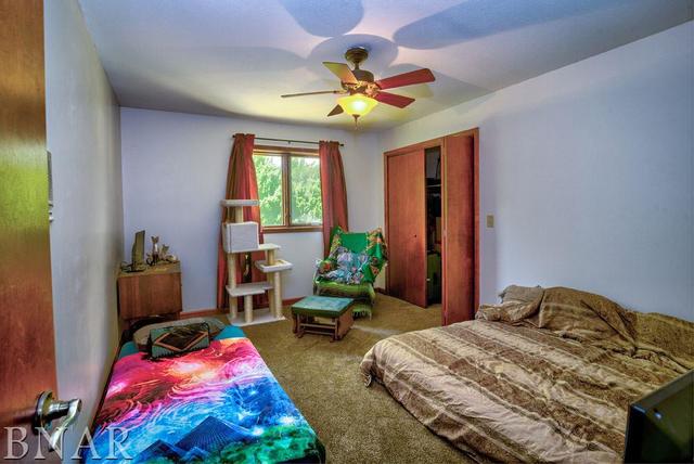 9537 Tabor Road Clinton, IL 61727 - Photo 11 of 17 a bedroom with bed and balcony