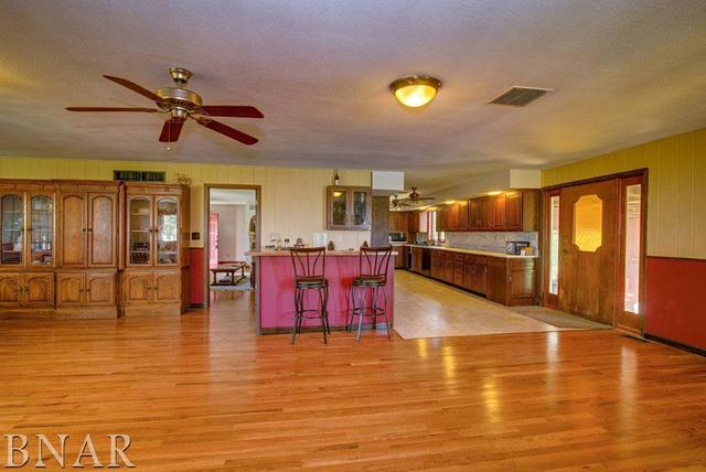 9537 Tabor Road Clinton, IL 61727 - Photo 4 of 17 a living room with fireplace furniture and a table