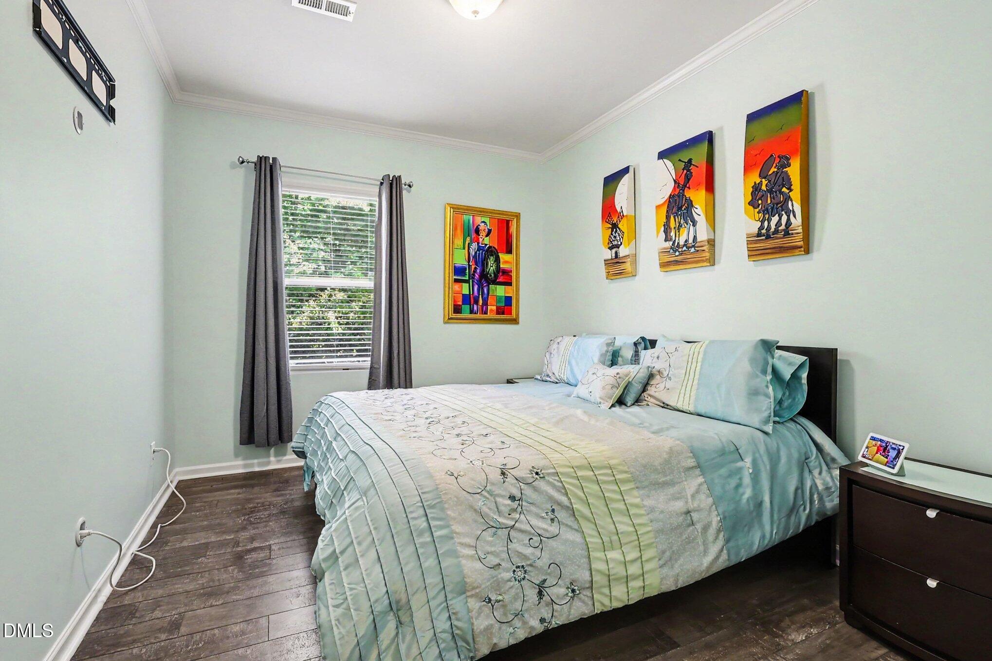 4366 Auburn Hills Drive Raleigh, NC 27616 - Photo 16 of 40 a bedroom with a bed and a window