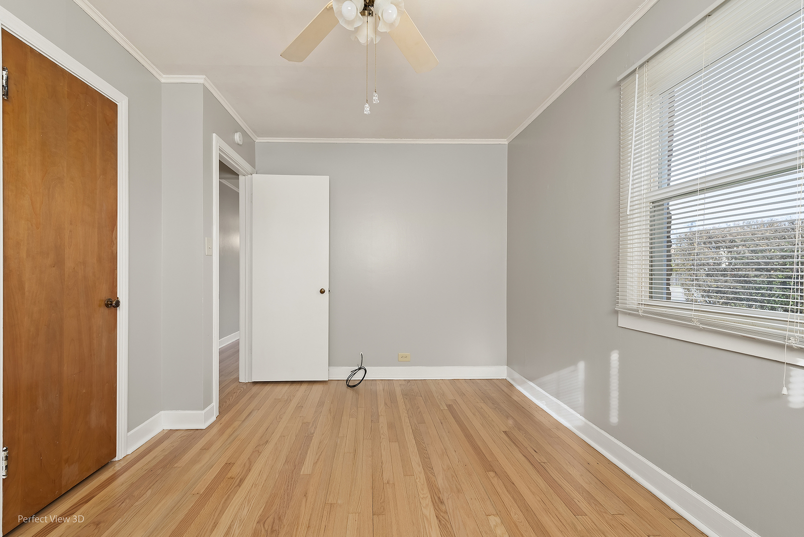 603 West Rand Road Mount Prospect, IL 60056 - Photo 14 of 20 a view of an empty room with wooden floor and a window
