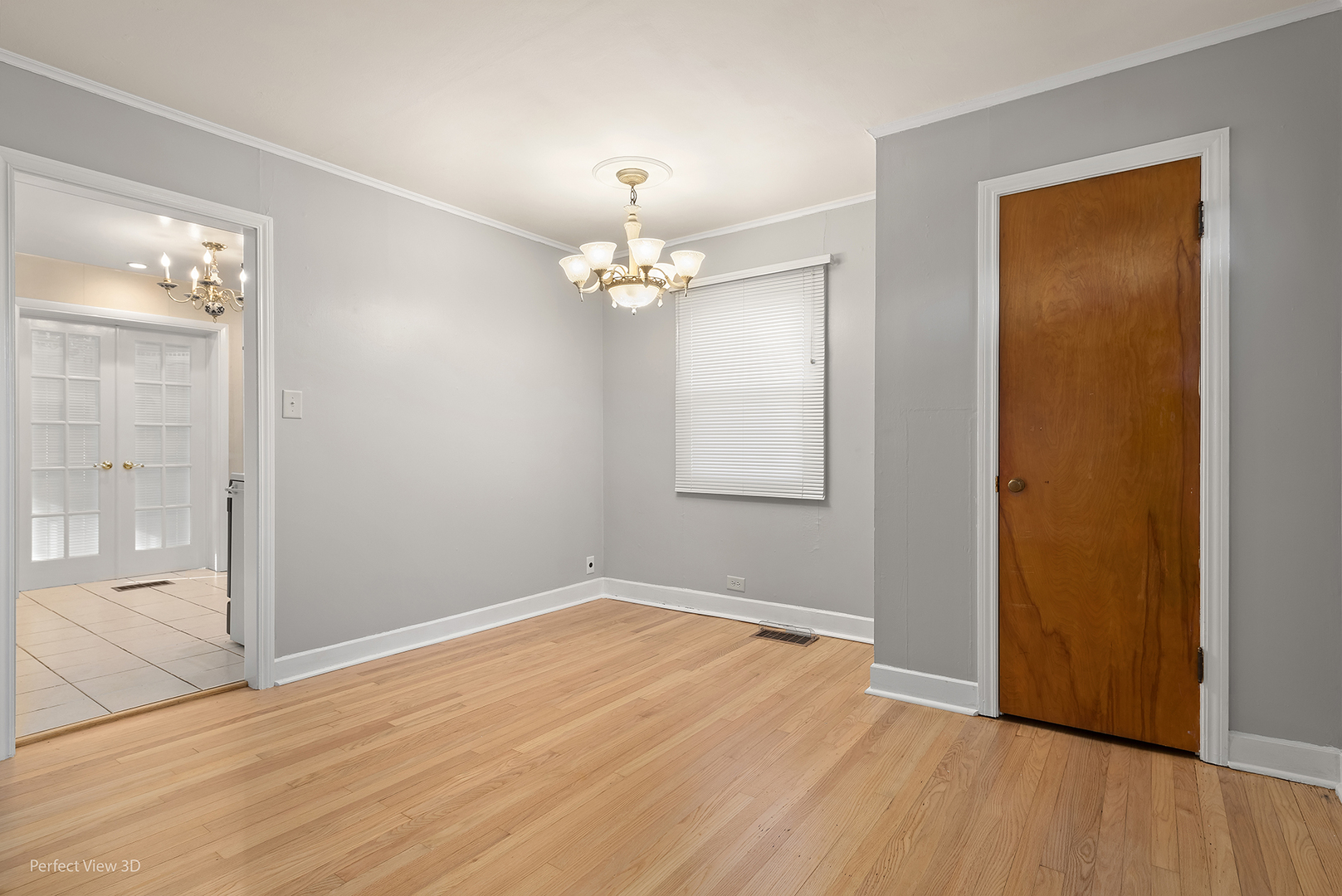 603 West Rand Road Mount Prospect, IL 60056 - Photo 4 of 20 an empty room with wooden floor and mirror