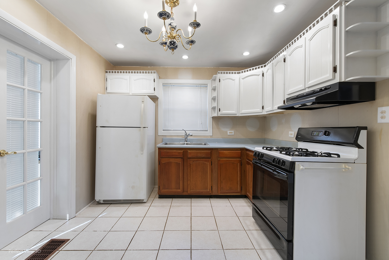 603 West Rand Road Mount Prospect, IL 60056 - Photo 6 of 20 a kitchen with a stove a refrigerator and a sink