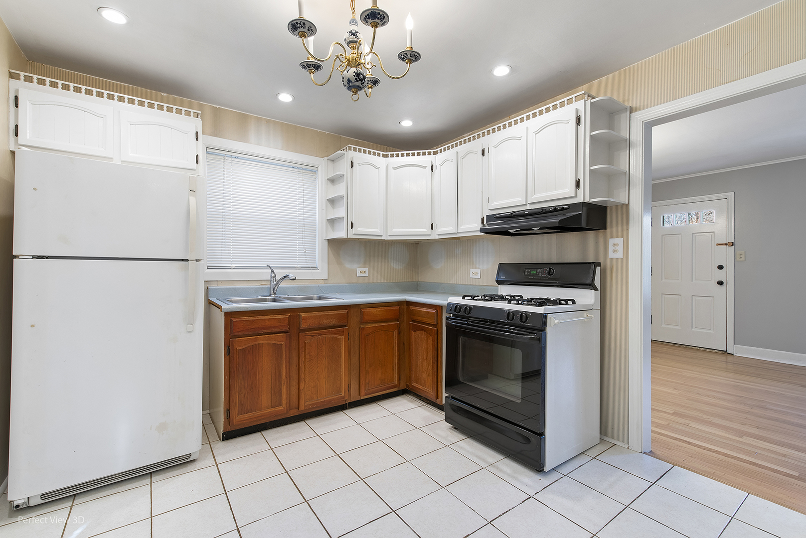 603 West Rand Road Mount Prospect, IL 60056 - Photo 7 of 20 a kitchen with stainless steel appliances granite countertop a refrigerator sink and white cabinets