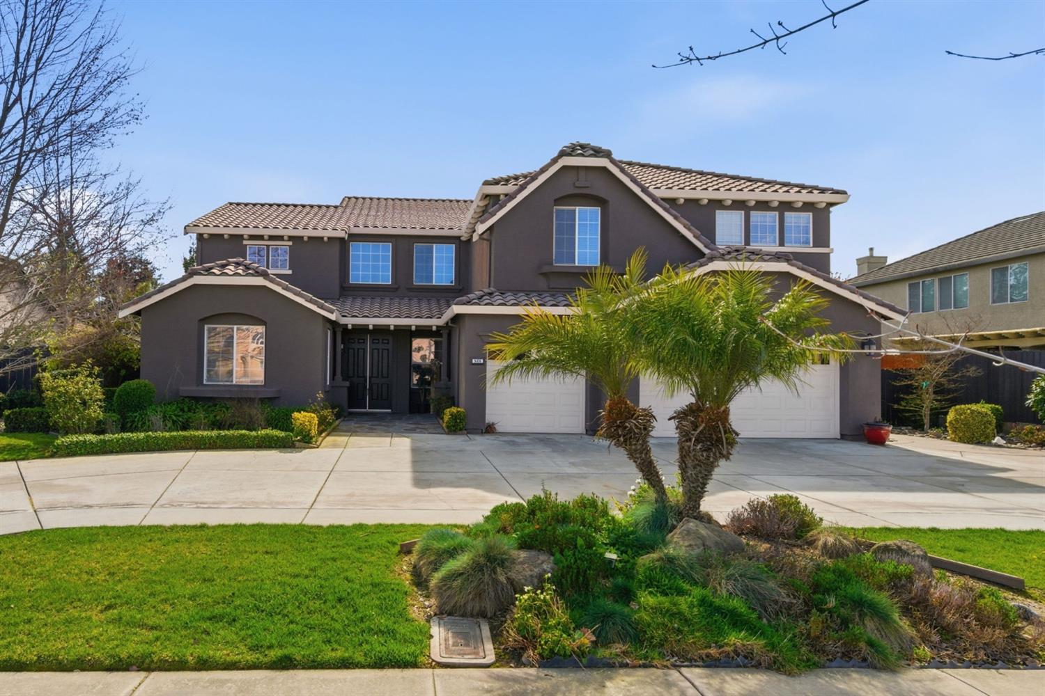 848 West Santos Avenue Ripon, CA 95366 - Photo 1 of 63 a front view of a house with garden