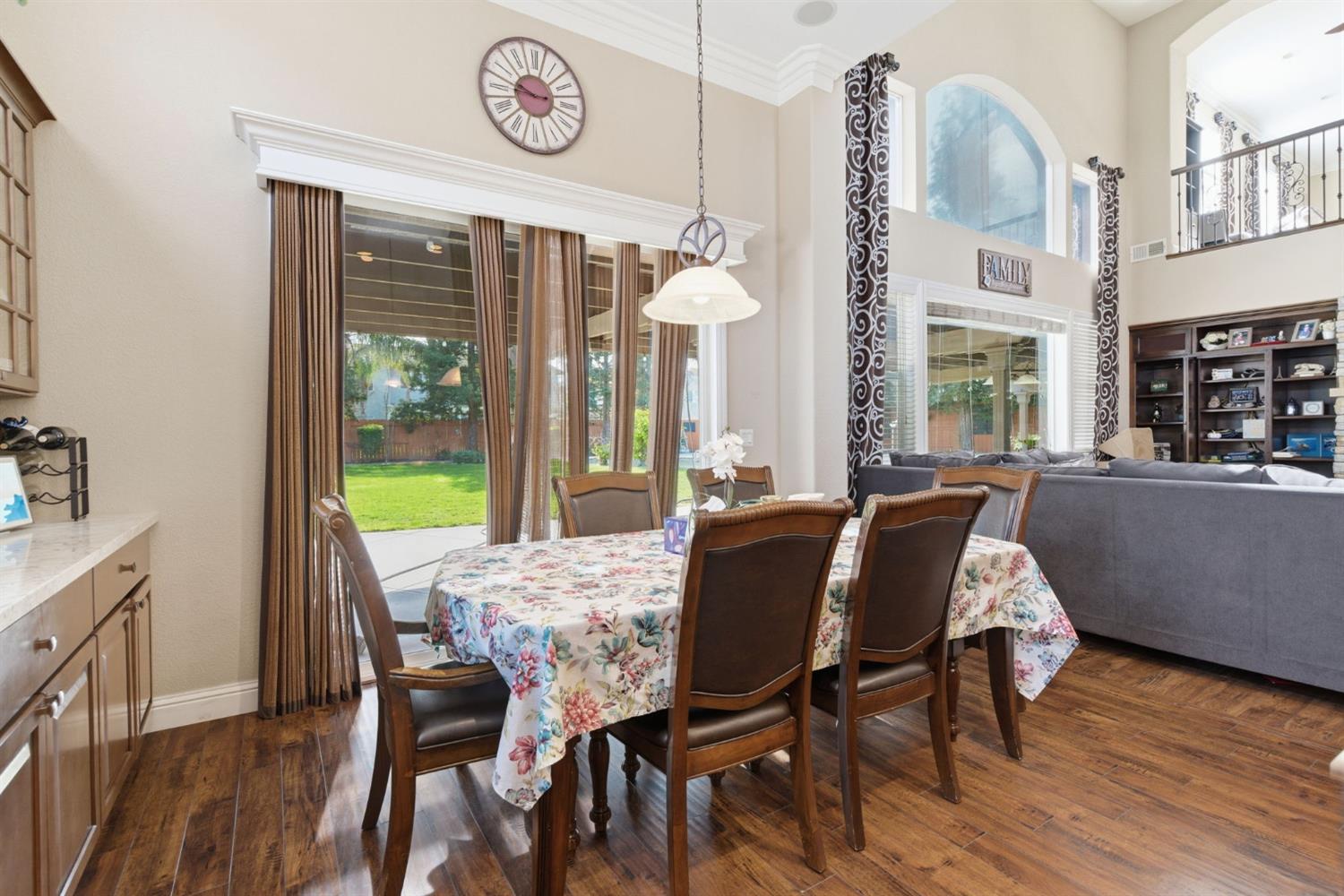 848 West Santos Avenue Ripon, CA 95366 - Photo 21 of 63 a view of a dining room with furniture window and wooden floor