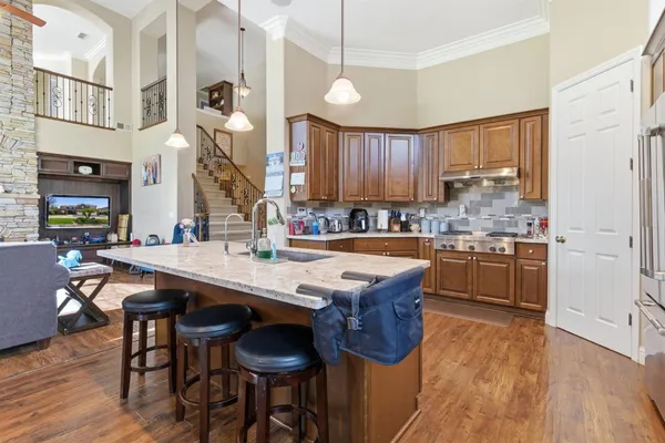 a room with a sink and cabinets