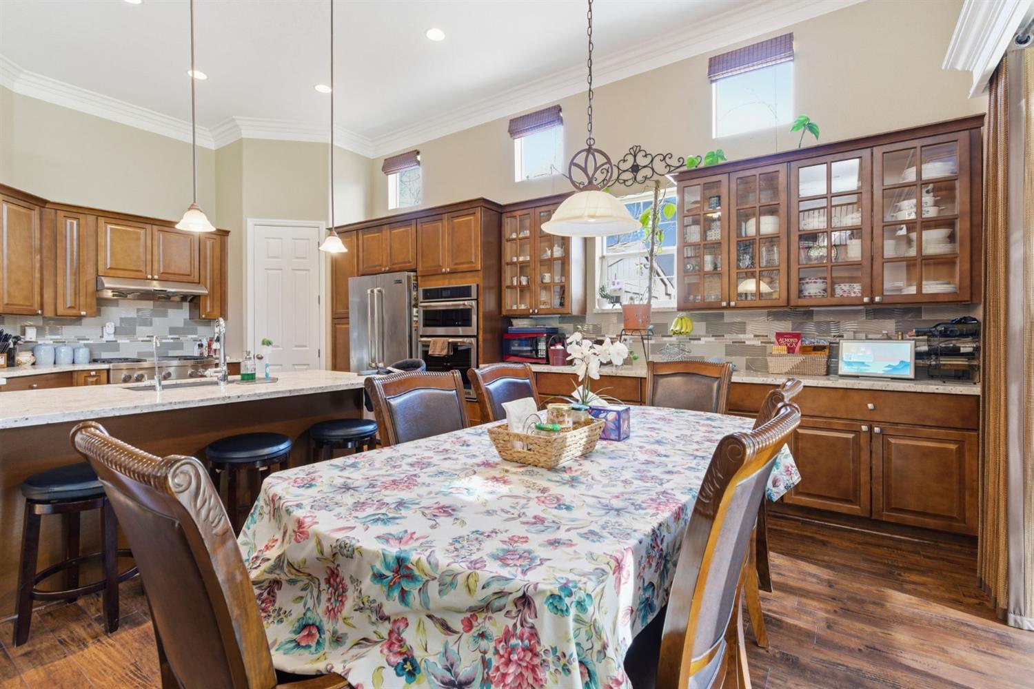 848 West Santos Avenue Ripon, CA 95366 - Photo 24 of 63 a large kitchen with a table and chairs