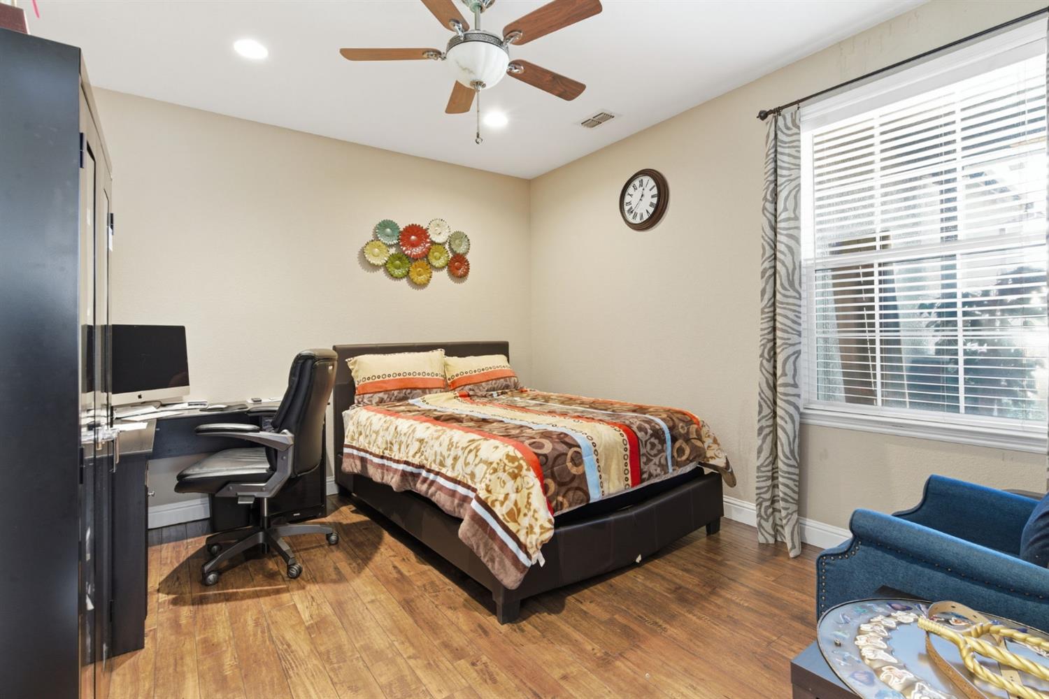 848 West Santos Avenue Ripon, CA 95366 - Photo 26 of 63 a bedroom with a bed and a desk