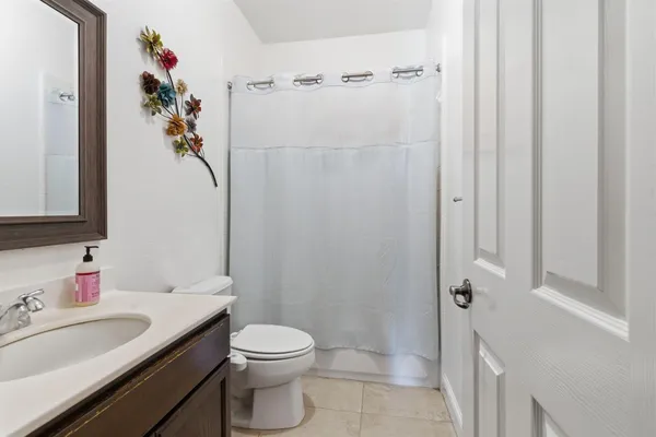 a bedroom with furniture and a chandelier
