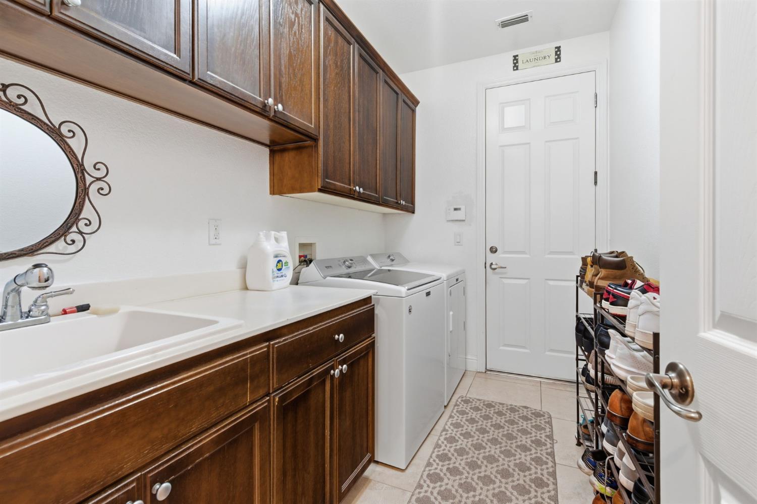 848 West Santos Avenue Ripon, CA 95366 - Photo 28 of 63 a room with a sink and cabinets