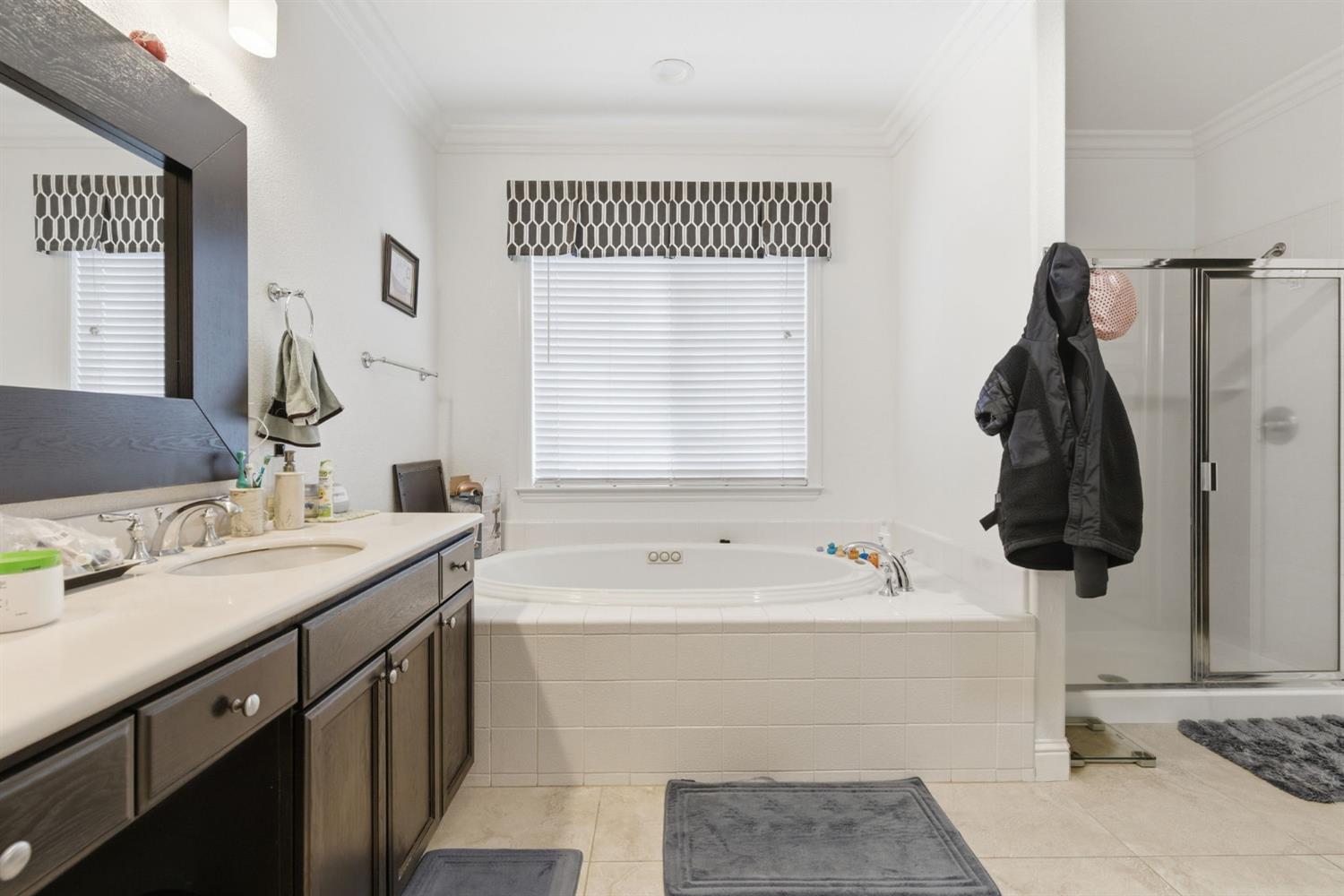 848 West Santos Avenue Ripon, CA 95366 - Photo 30 of 63 a bathroom with a sink and a mirror