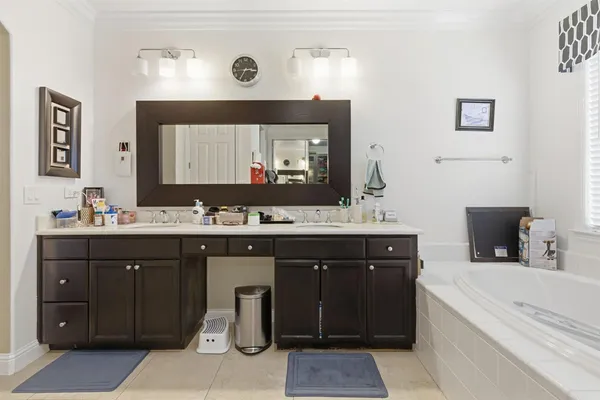 a living room with furniture ceiling fan and a rug