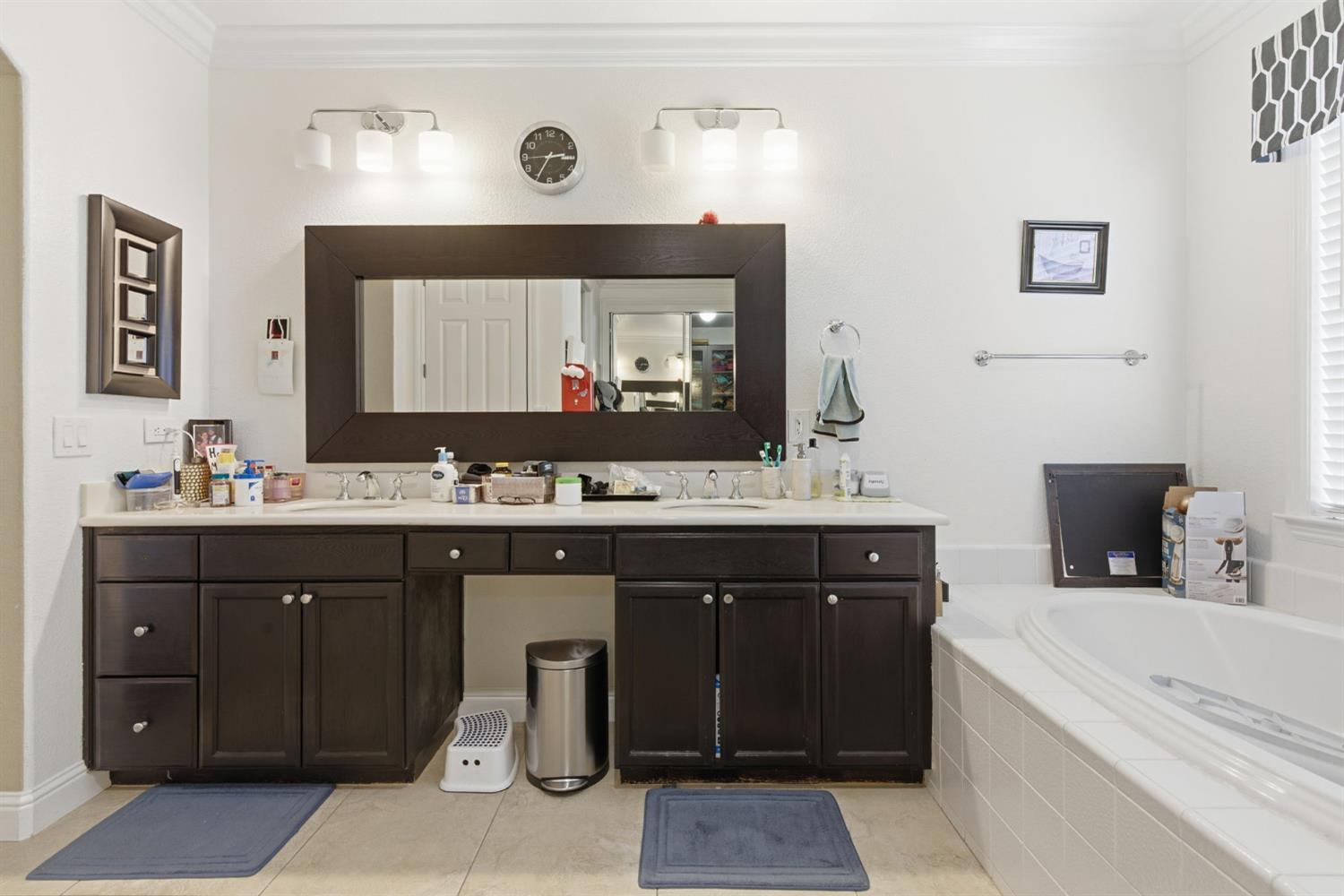 848 West Santos Avenue Ripon, CA 95366 - Photo 31 of 63 a bathroom with a sink double vanity and a mirror