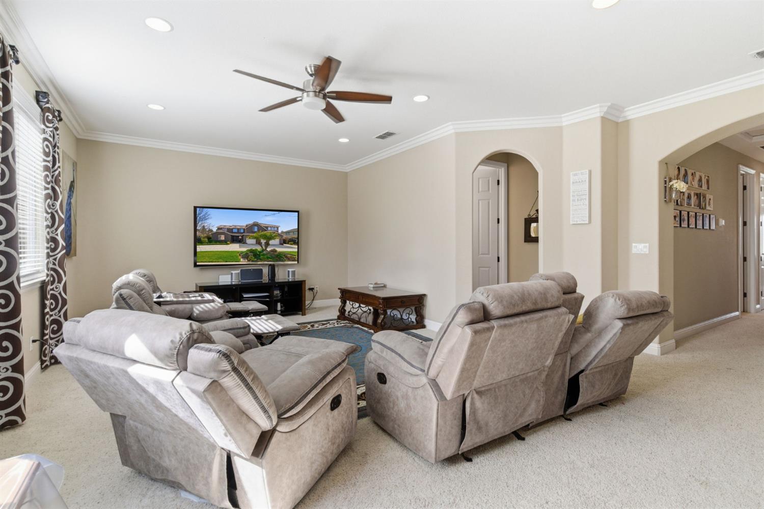 848 West Santos Avenue Ripon, CA 95366 - Photo 36 of 63 a living room with furniture and a flat screen tv