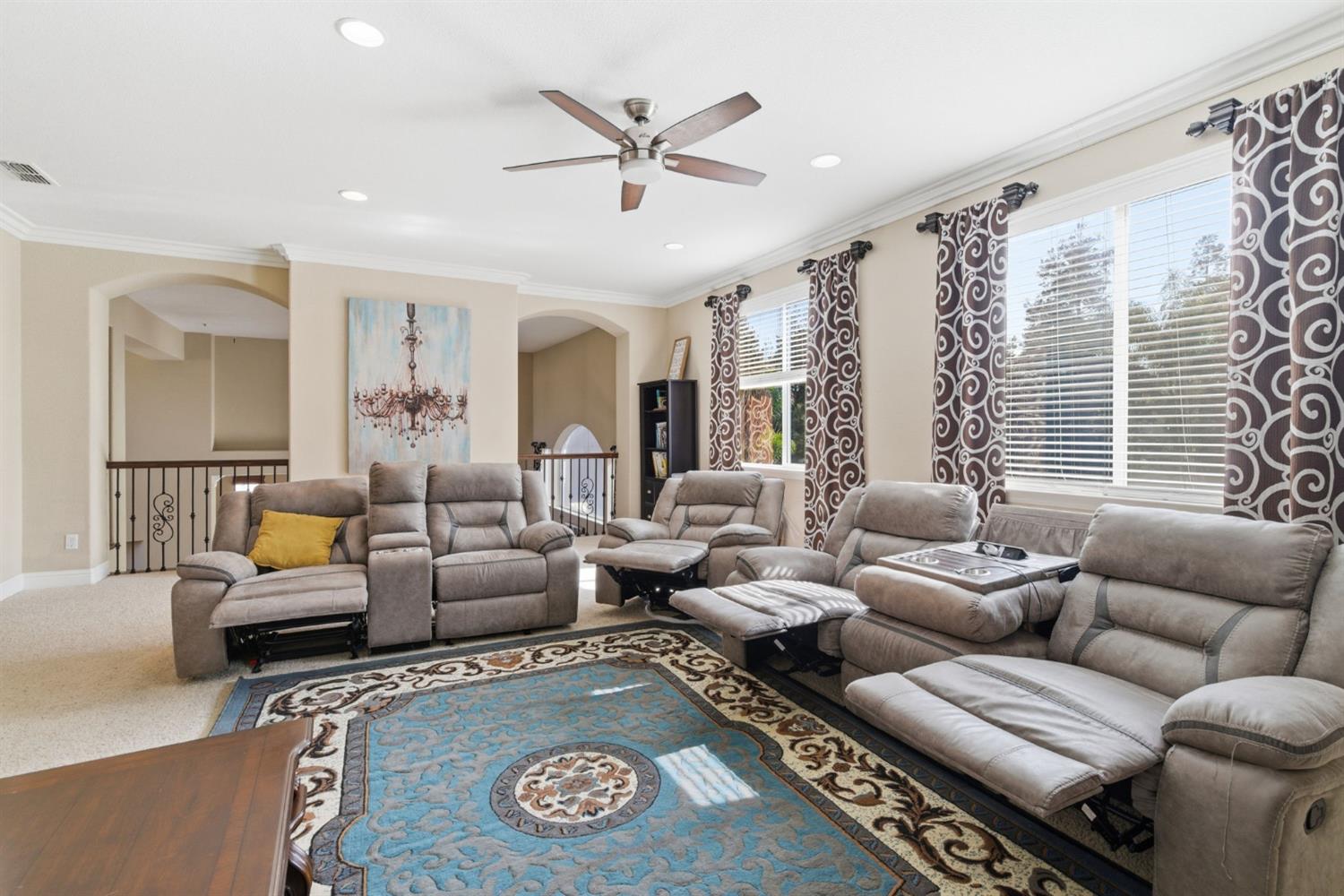 848 West Santos Avenue Ripon, CA 95366 - Photo 37 of 63 a living room with furniture ceiling fan and a rug