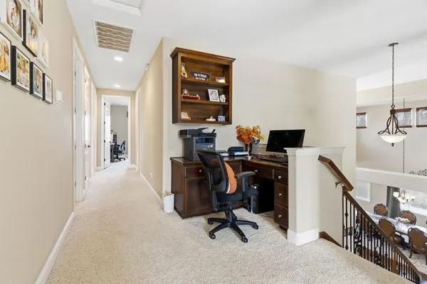 a bed room with a bed and a chair