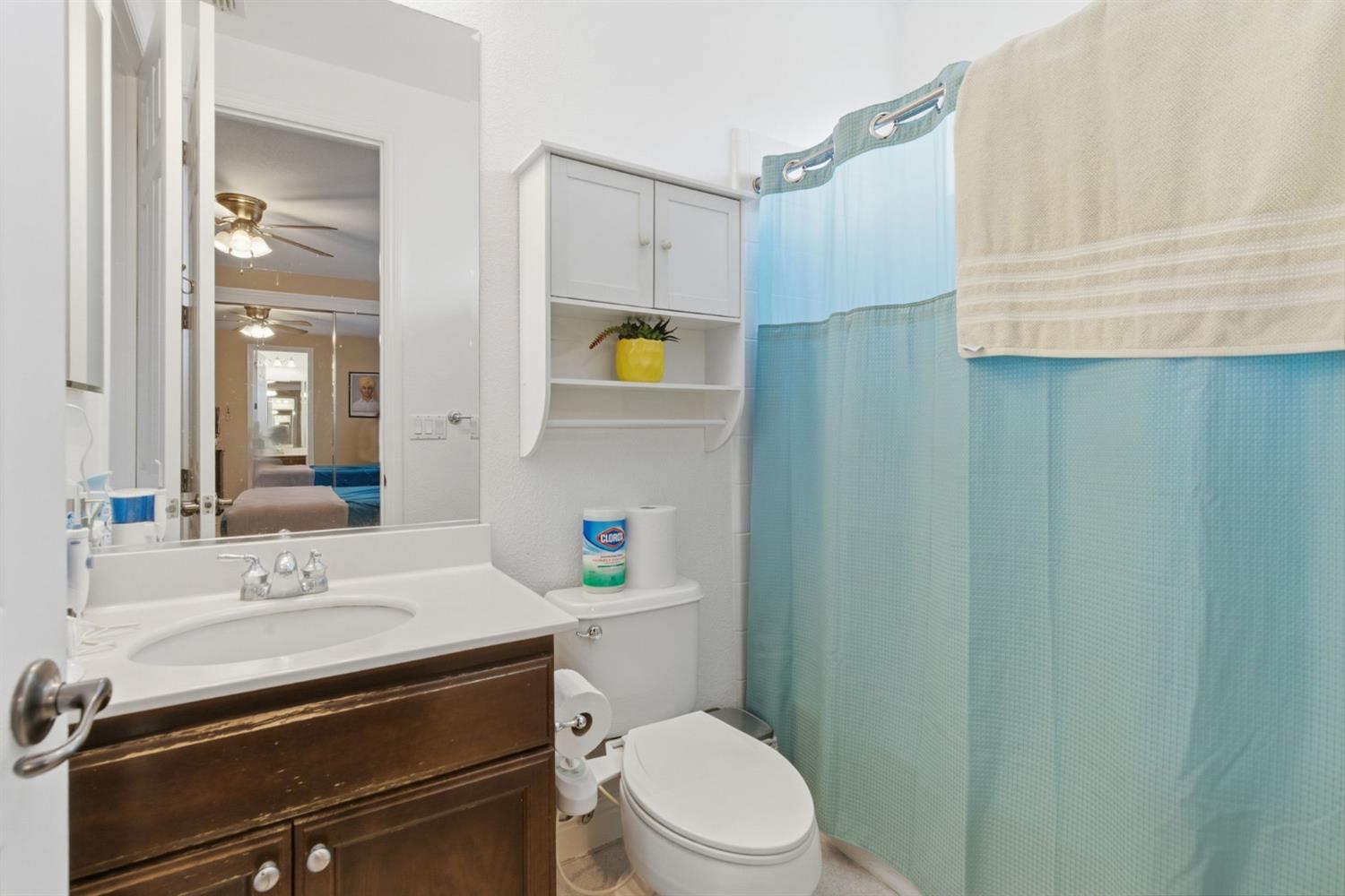 848 West Santos Avenue Ripon, CA 95366 - Photo 40 of 63 a bathroom with a sink a toilet and vanity