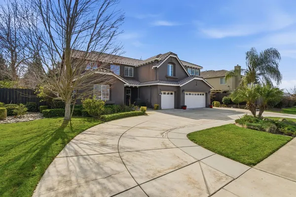 a front view of a house with yard