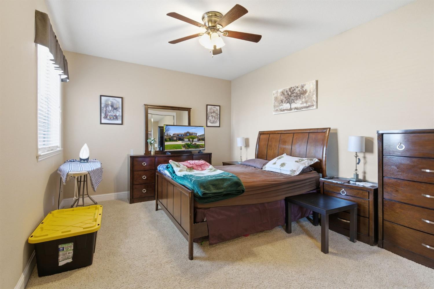 848 West Santos Avenue Ripon, CA 95366 - Photo 44 of 63 a bed room with a bed and a chair