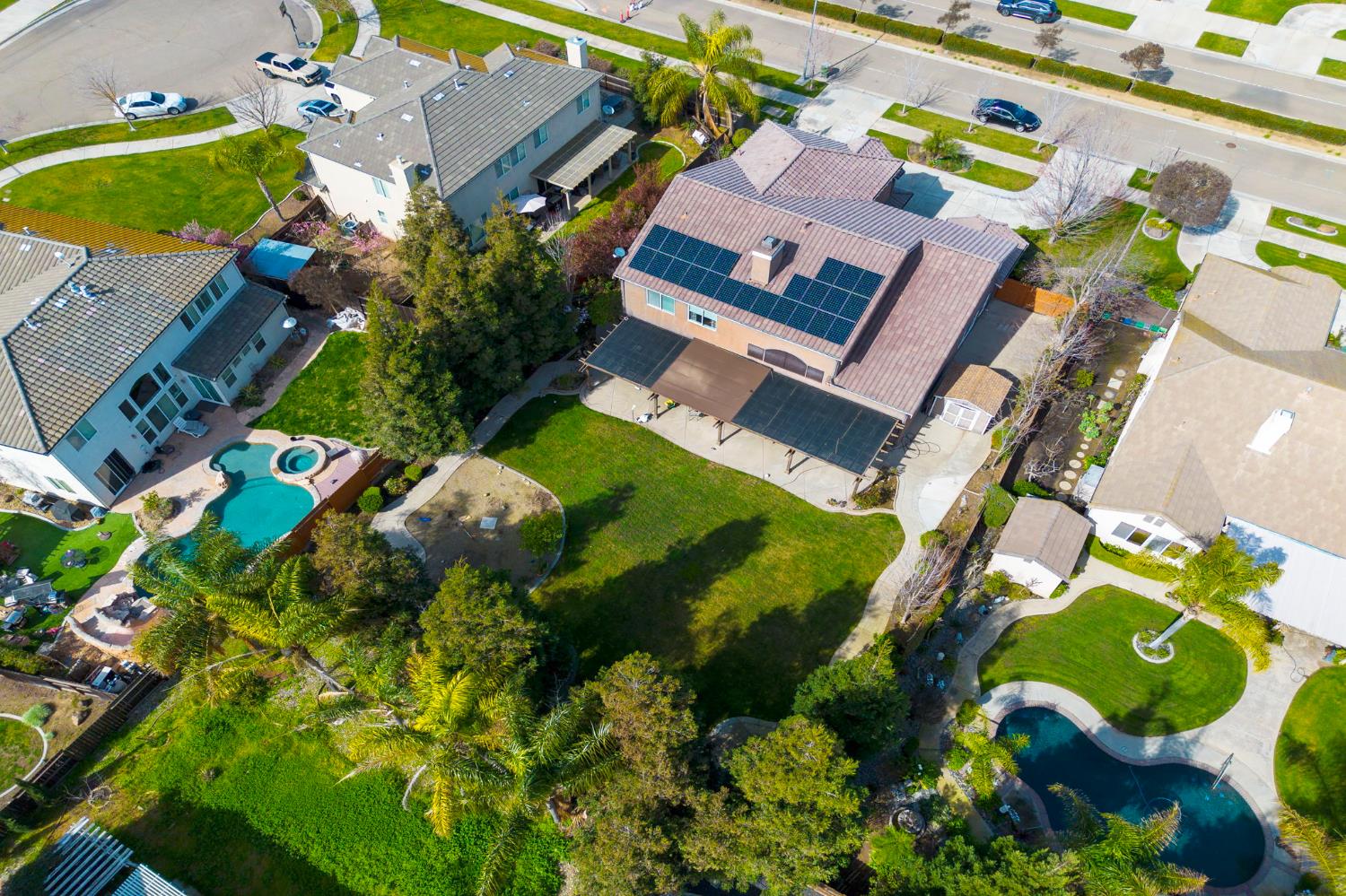 848 West Santos Avenue Ripon, CA 95366 - Photo 55 of 63 an aerial view of a house with a yard and garden