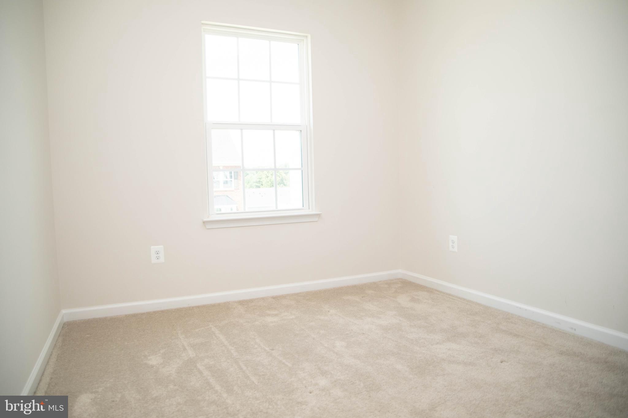 1813 Wind Gate Road Baltimore, MD 21227 - Photo 19 of 27 an empty room with a window