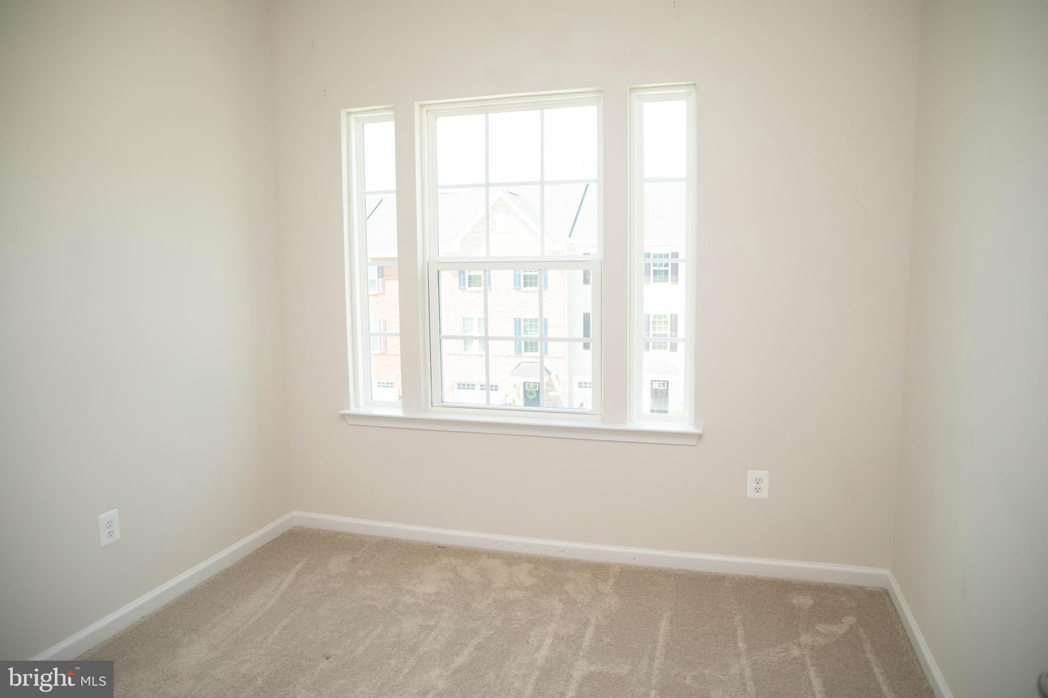 1813 Wind Gate Road Baltimore, MD 21227 - Photo 20 of 27 an empty room with a window