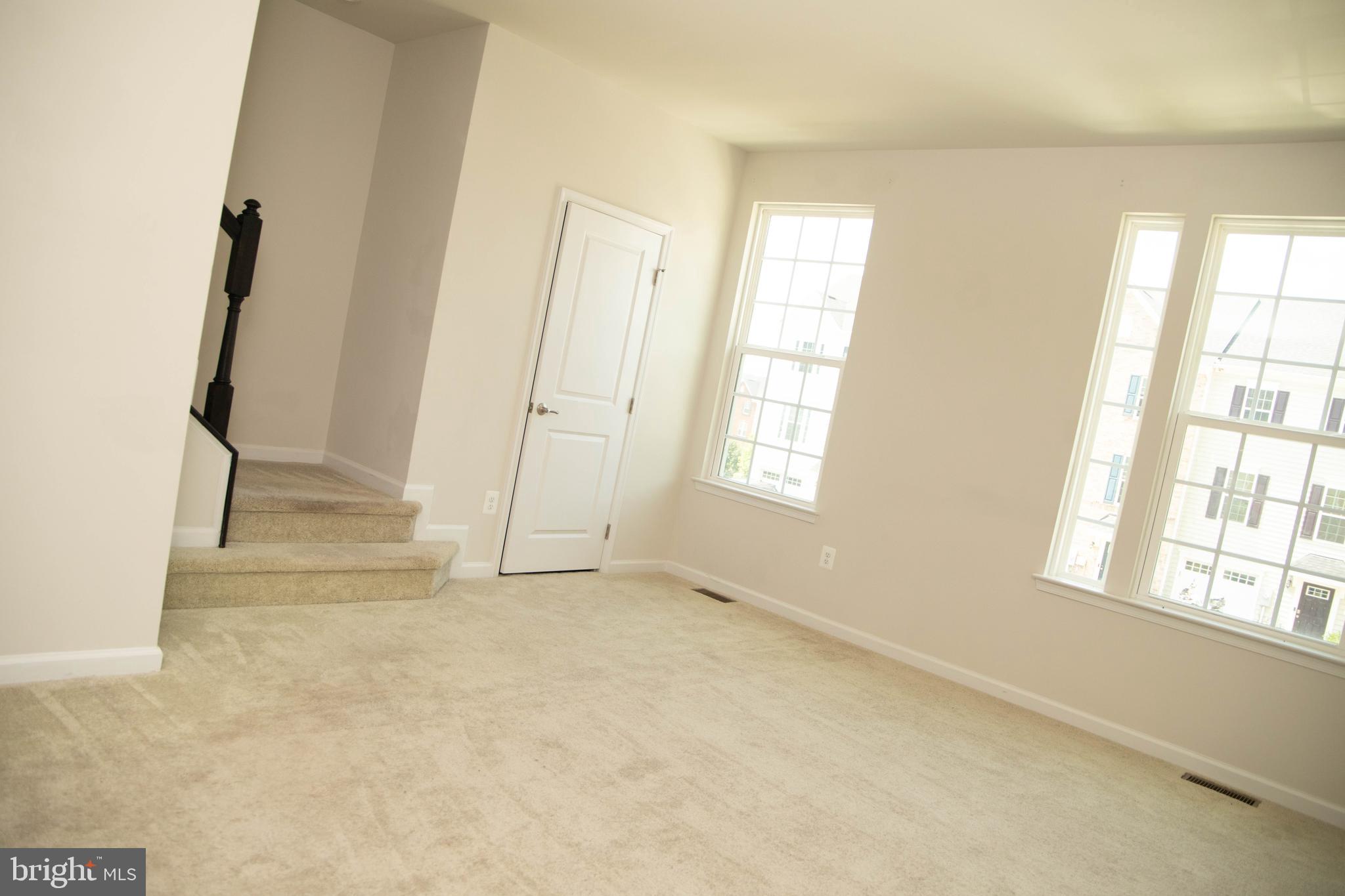 1813 Wind Gate Road Baltimore, MD 21227 - Photo 23 of 27 an empty room with windows