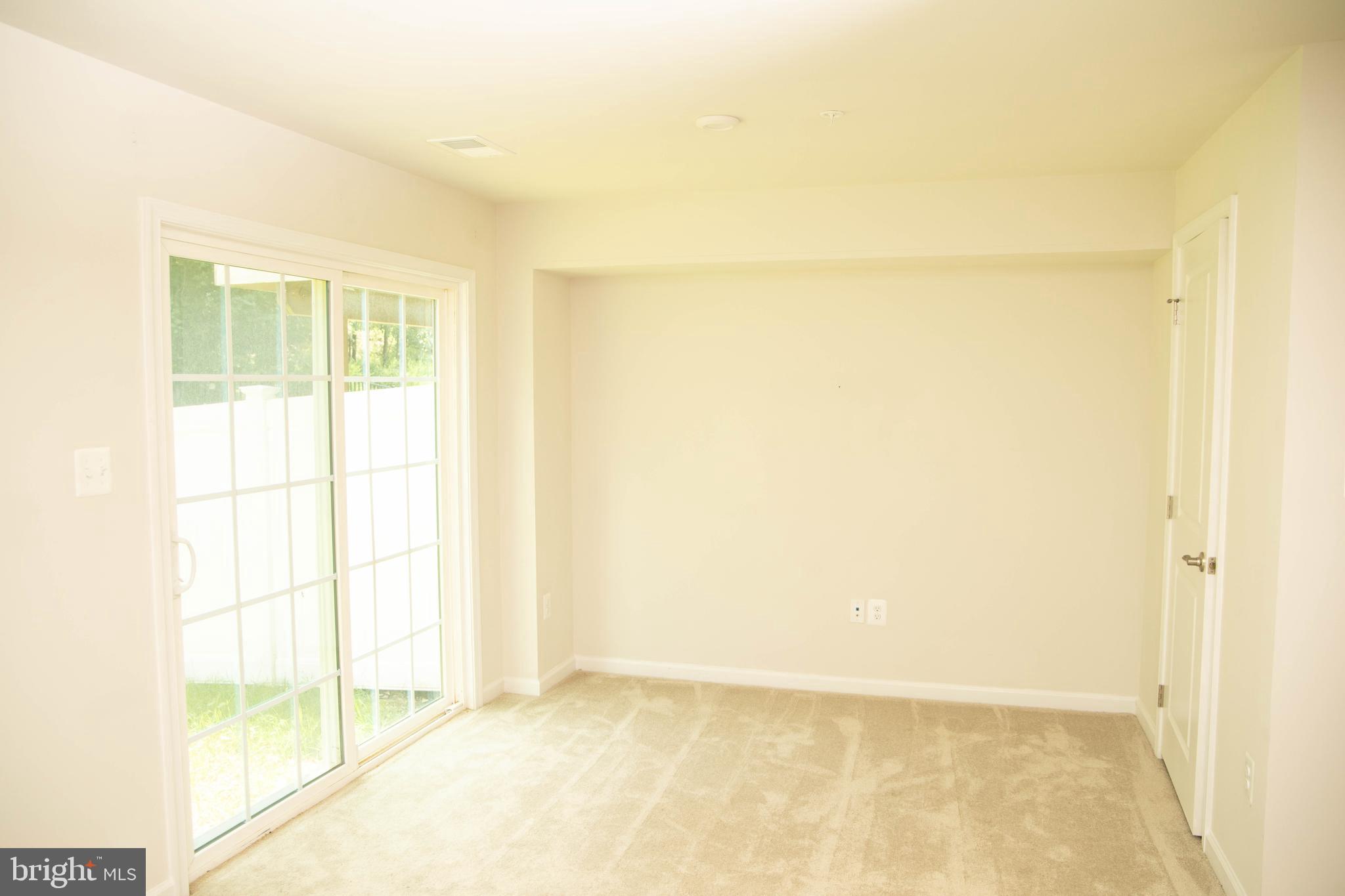 1813 Wind Gate Road Baltimore, MD 21227 - Photo 24 of 27 a view of an empty room and window