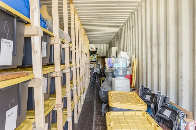 a view of walk in closet with large windows
