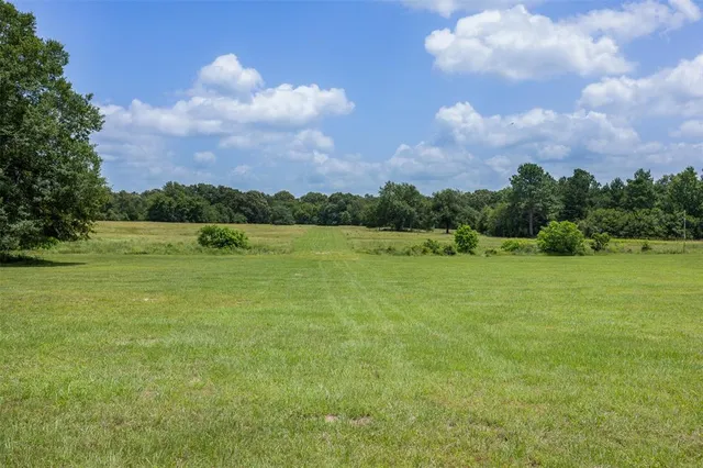 a view of a lake with houses in the back
