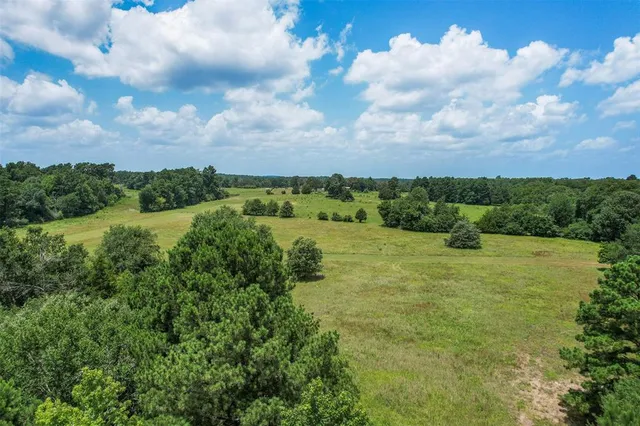 a view of a lake with houses in the back