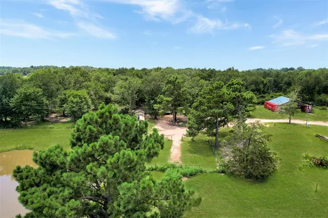 a view of a lake with houses in all around